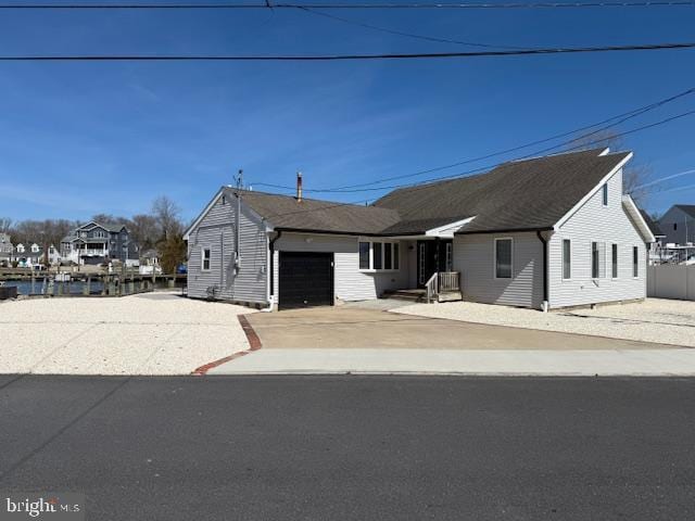 view of front of property with an attached garage and concrete driveway