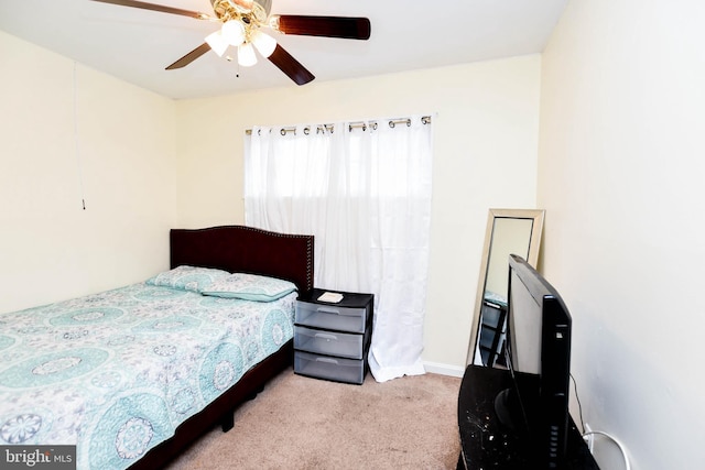 carpeted bedroom with a ceiling fan