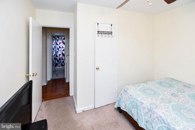 bedroom featuring a closet and light colored carpet