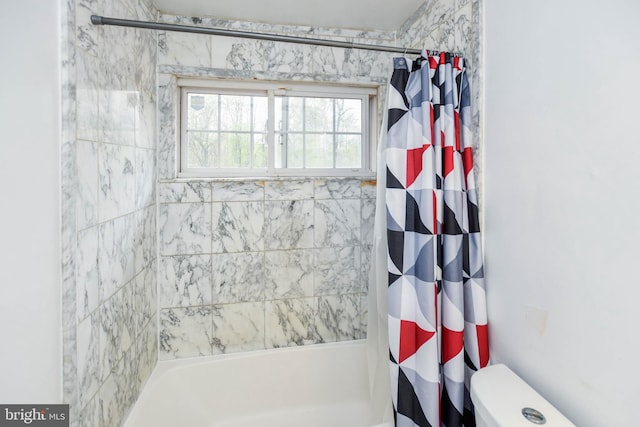 full bathroom with shower / bath combo and toilet