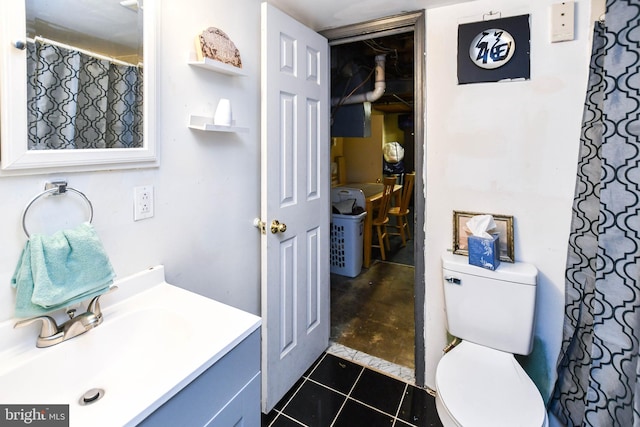 full bathroom with tile patterned floors, vanity, and toilet