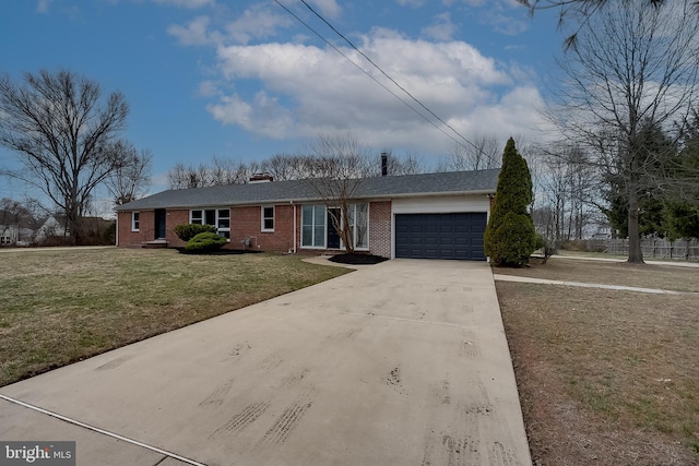 ranch-style house with a front lawn, a garage, brick siding, and concrete driveway