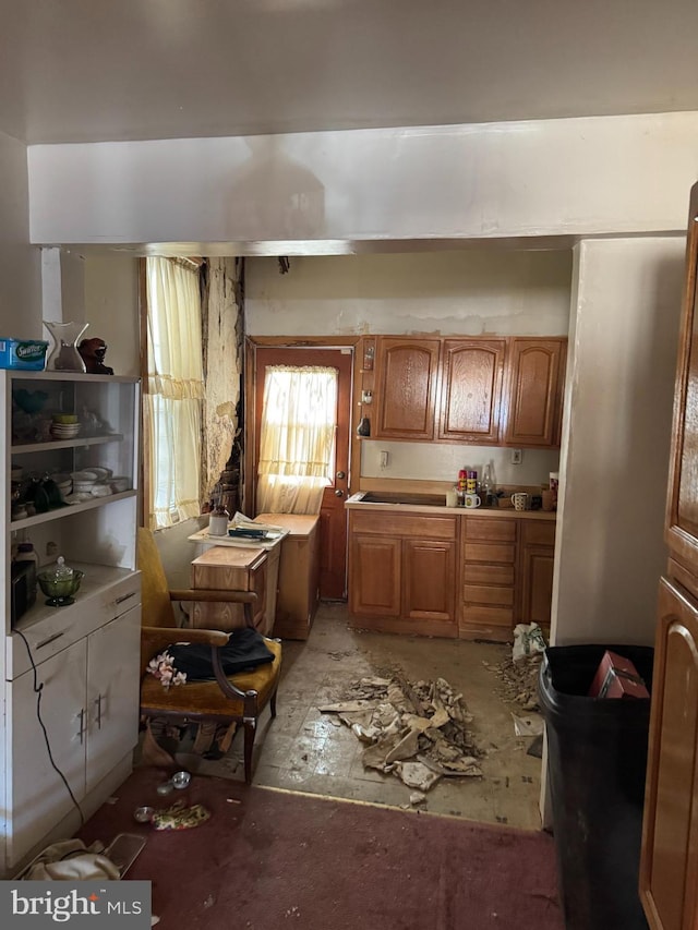 kitchen featuring brown cabinets and light countertops