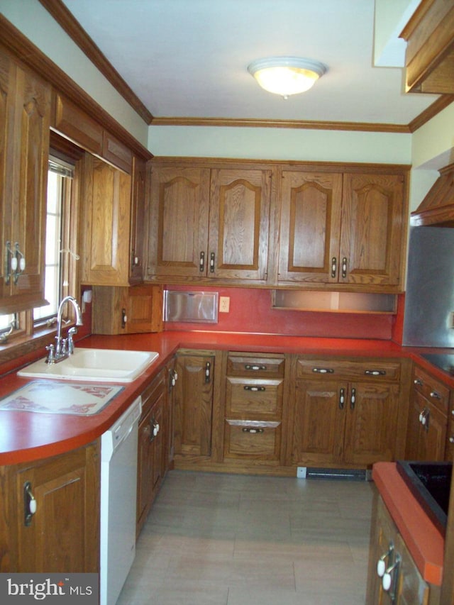 kitchen with brown cabinetry, dishwasher, and a sink