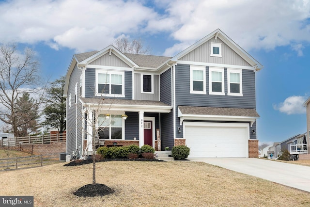 craftsman inspired home featuring driveway, fence, board and batten siding, an attached garage, and brick siding