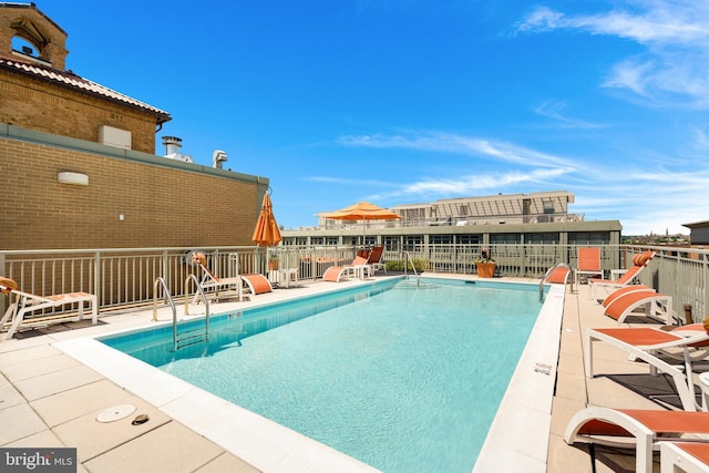 community pool with a patio