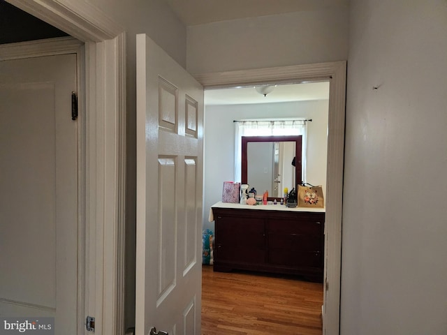 corridor featuring wood finished floors