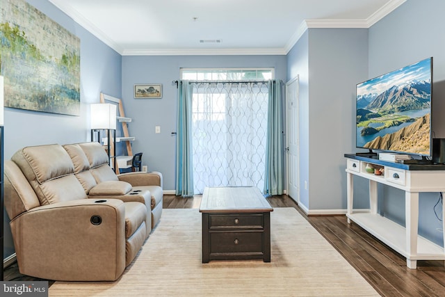 living room featuring crown molding, wood finished floors, baseboards, and visible vents