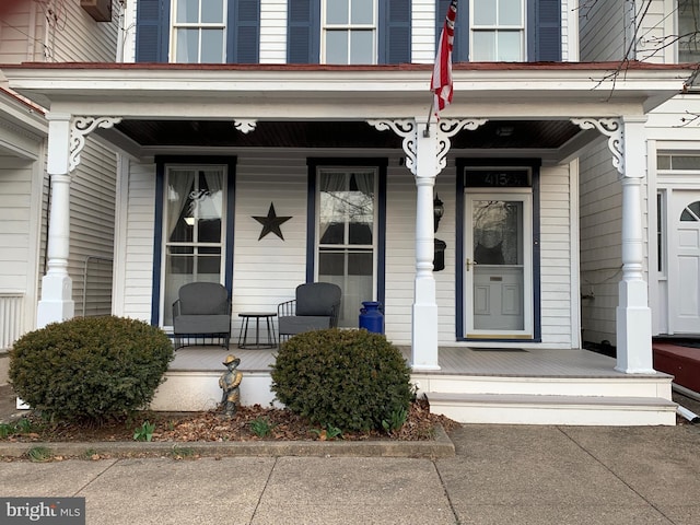 property entrance with covered porch