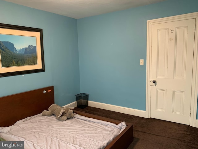 carpeted bedroom with baseboards