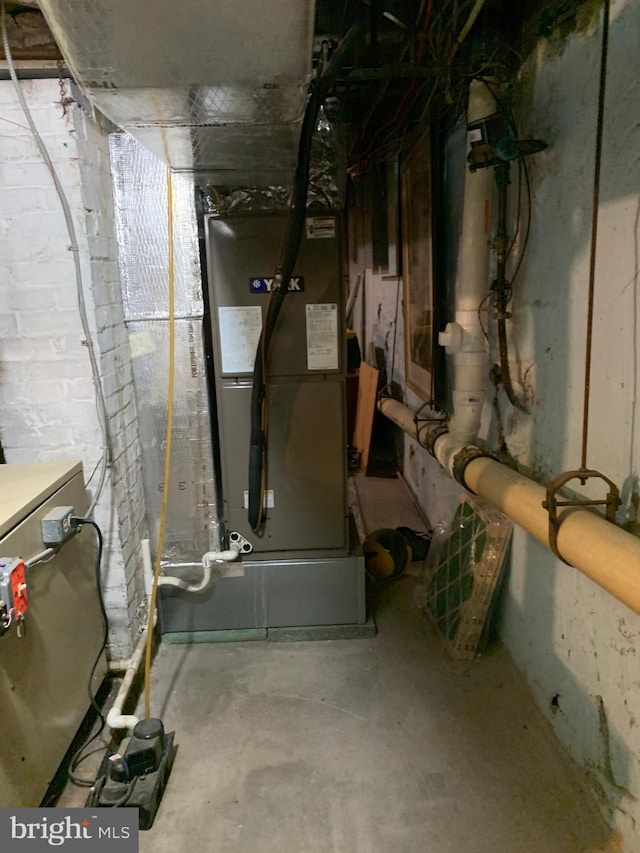 utility room with heating unit