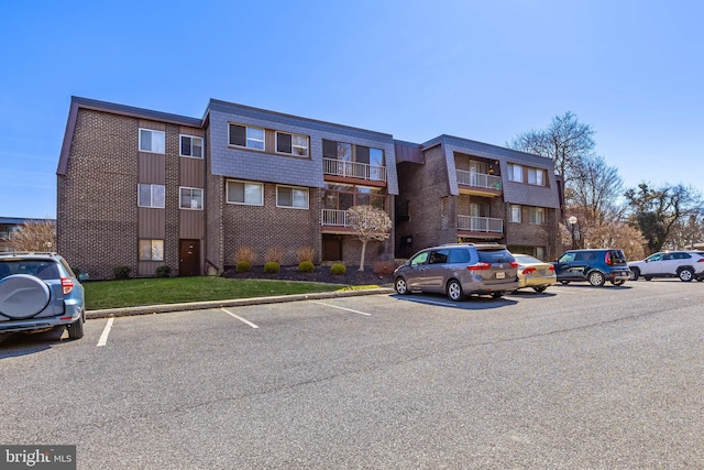 view of property with uncovered parking