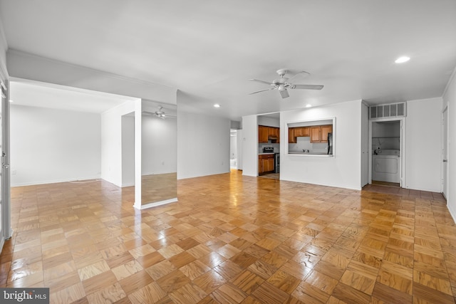 unfurnished living room with washer / dryer, recessed lighting, visible vents, and ceiling fan