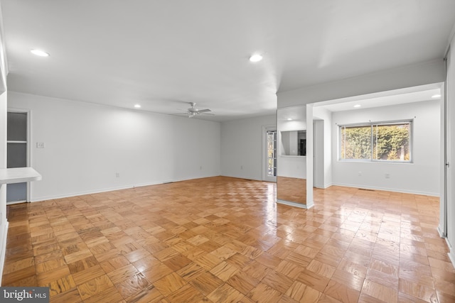 interior space featuring recessed lighting, baseboards, and a ceiling fan