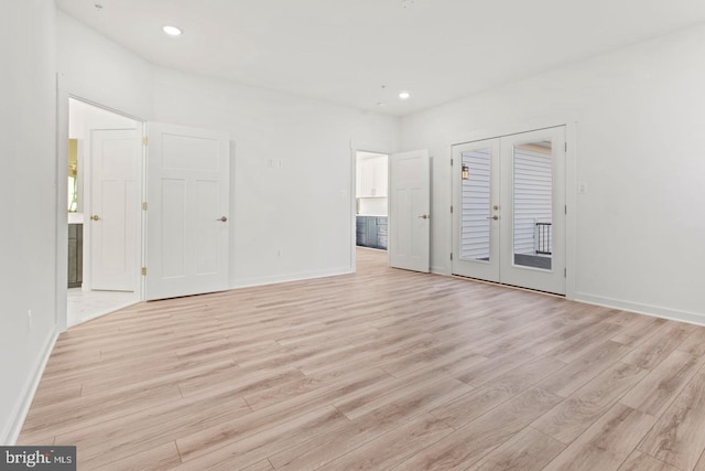 unfurnished bedroom with recessed lighting, french doors, and light wood finished floors