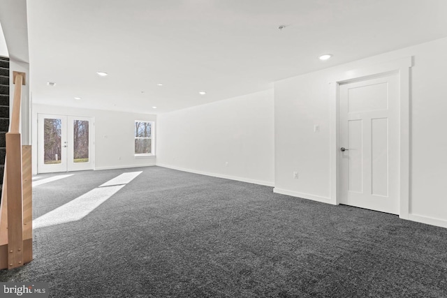 empty room featuring stairway, baseboards, recessed lighting, french doors, and dark carpet