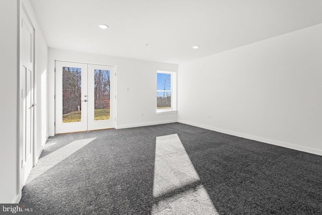 carpeted empty room with recessed lighting, french doors, and baseboards