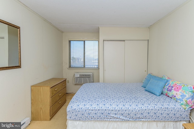 bedroom with light colored carpet, a closet, a wall mounted air conditioner, and ornamental molding