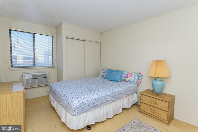 bedroom with a closet, light colored carpet, and a wall mounted air conditioner