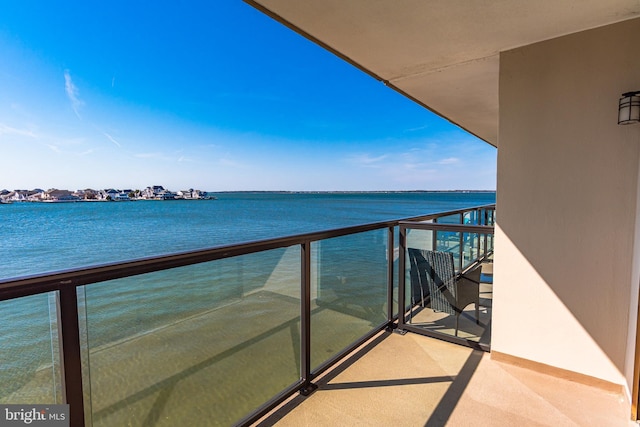 balcony featuring a water view