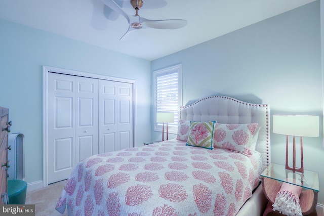 bedroom featuring a closet, baseboards, a ceiling fan, and carpet floors