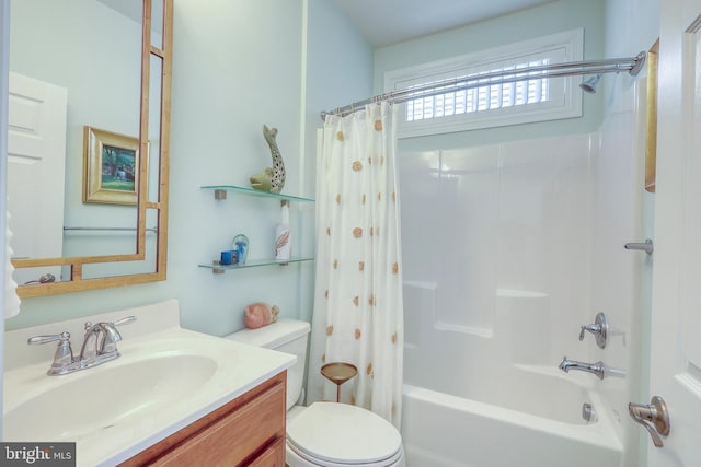 full bathroom featuring toilet, shower / bath combo, and vanity