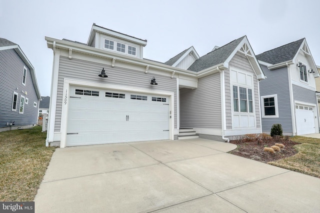 view of front of home with driveway and a garage