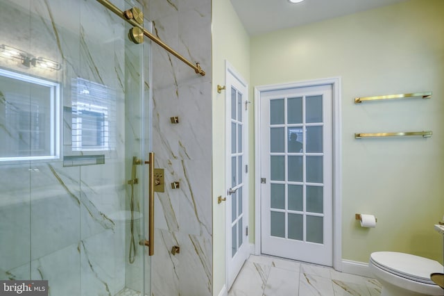 full bathroom featuring a marble finish shower, baseboards, toilet, and marble finish floor