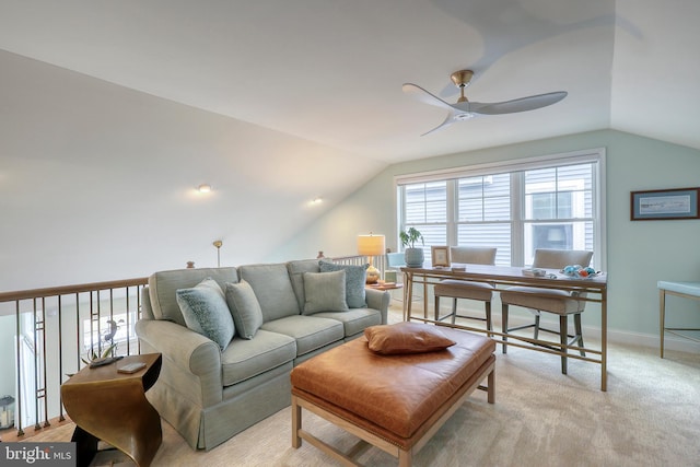 living room with light colored carpet, vaulted ceiling, a ceiling fan, and baseboards