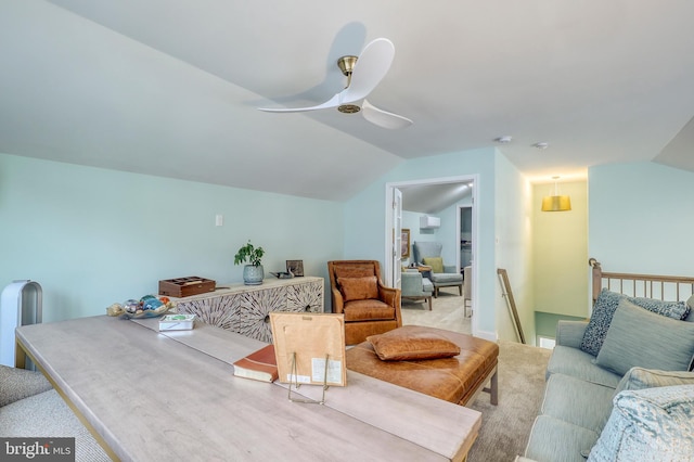 living room featuring carpet flooring, lofted ceiling, and ceiling fan