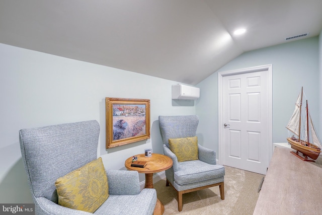 living area with vaulted ceiling, an AC wall unit, visible vents, and light carpet