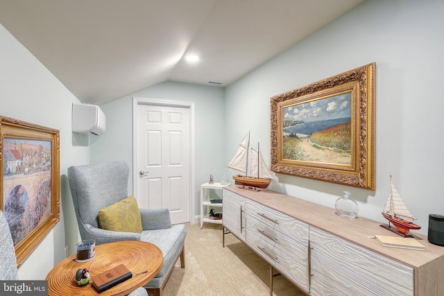 sitting room with visible vents, light colored carpet, an AC wall unit, and vaulted ceiling