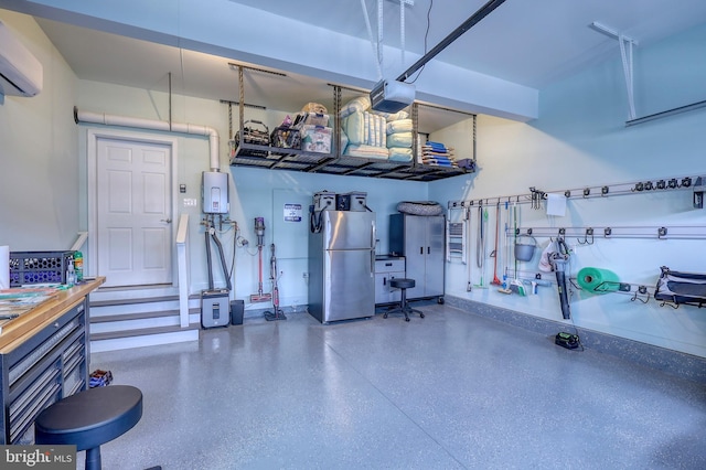 garage featuring tankless water heater, a garage door opener, a wall mounted AC, and freestanding refrigerator