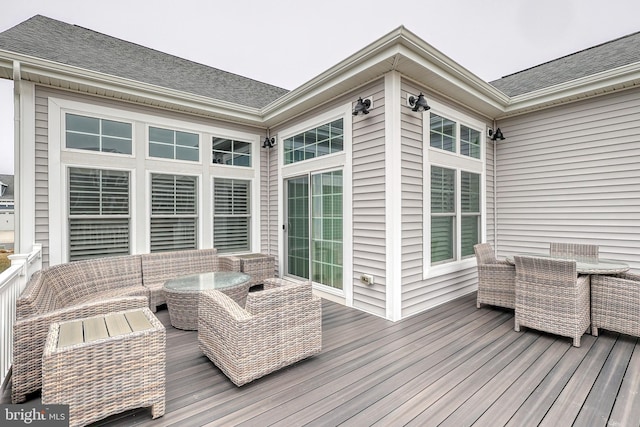 deck with outdoor dining area