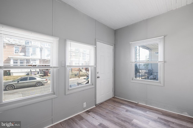 unfurnished room featuring wood finished floors and baseboards