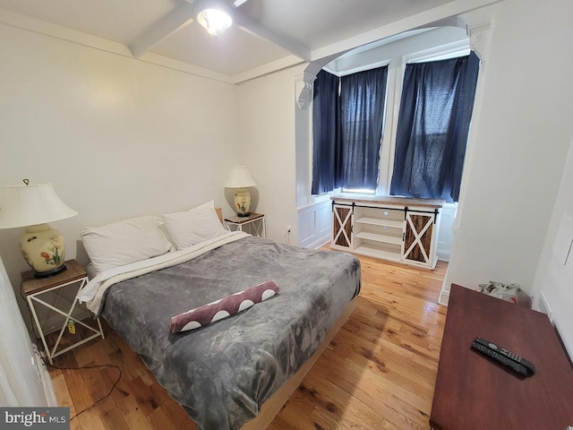 bedroom featuring wood finished floors