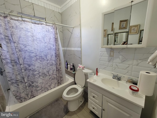 bathroom featuring tasteful backsplash, tile walls, toilet, shower / tub combo with curtain, and vanity