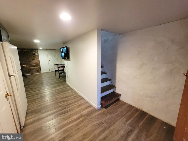 interior space featuring stairway, recessed lighting, and wood finished floors