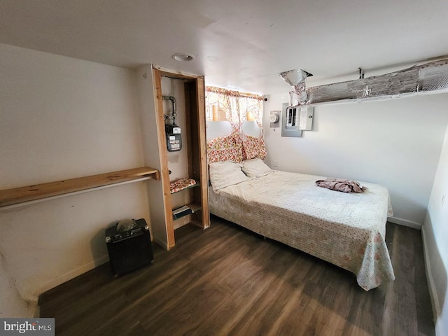 bedroom featuring dark wood-style floors