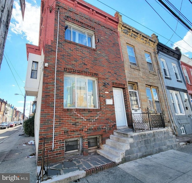 view of property with brick siding