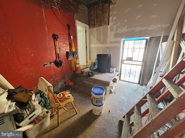 miscellaneous room with brick wall