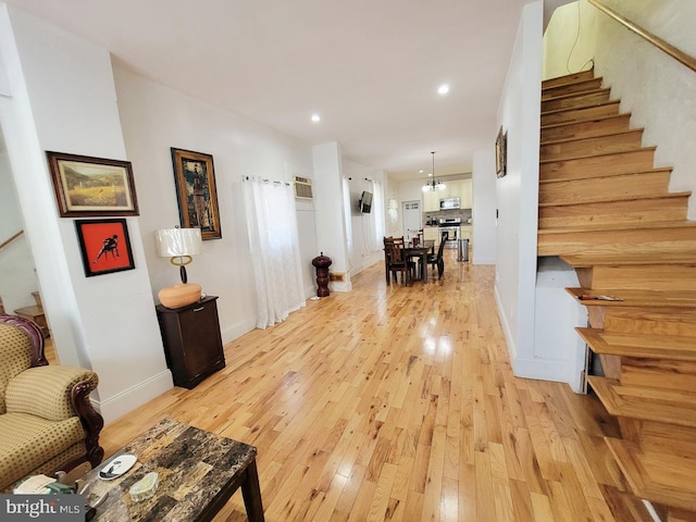 interior space featuring stairway, recessed lighting, light wood-style flooring, and baseboards