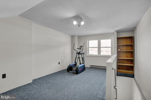 exercise area with a baseboard heating unit and carpet