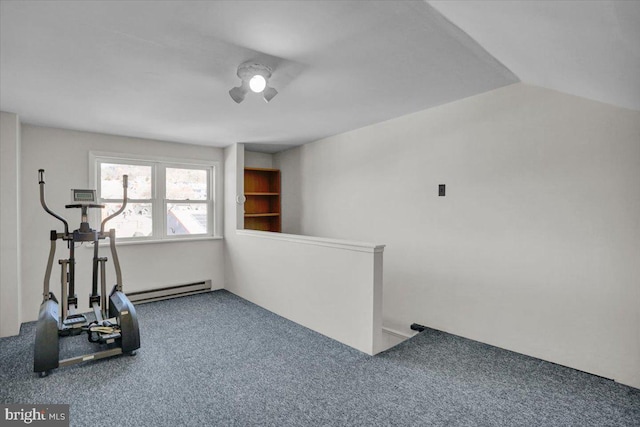 workout room featuring vaulted ceiling, carpet, and baseboard heating