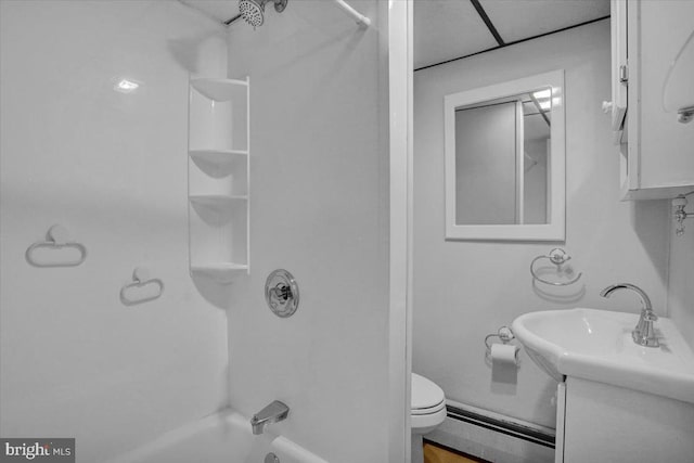 bathroom with a sink, toilet, shower / bathtub combination, and a baseboard radiator