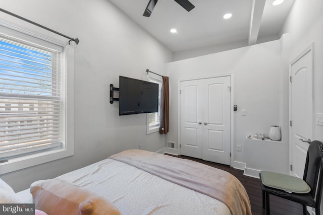 bedroom with a ceiling fan, dark wood-style floors, baseboards, recessed lighting, and a closet