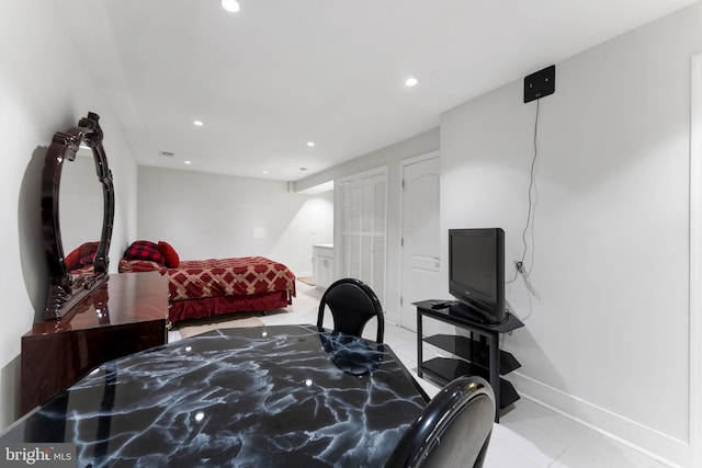 bedroom featuring light tile patterned flooring, recessed lighting, and baseboards