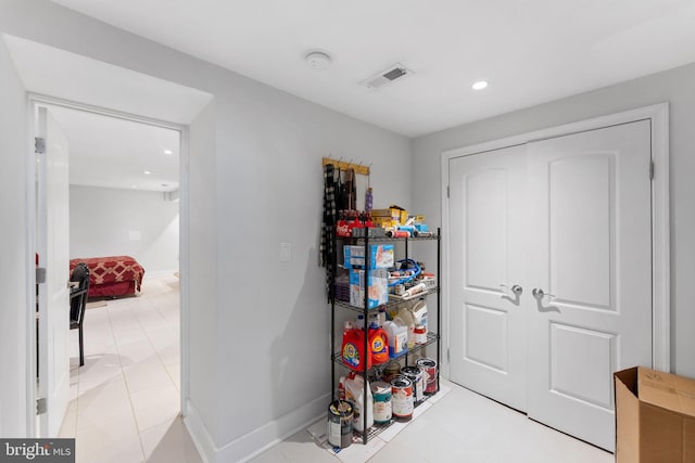 interior space featuring recessed lighting, baseboards, visible vents, and a closet