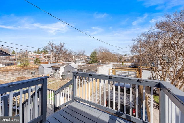 wooden deck featuring fence and a residential view