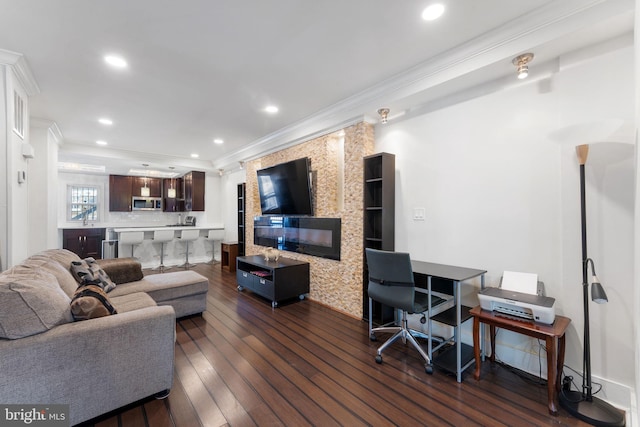 living room featuring dark wood-style flooring, recessed lighting, and ornamental molding